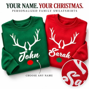 May include: A green sweatshirt with white reindeer antlers and the name John above a red circle, and a red sweatshirt with white reindeer antlers and the name Sarah above a green circle. Text reads: YOUR NAME. YOUR CHRISTMAS.