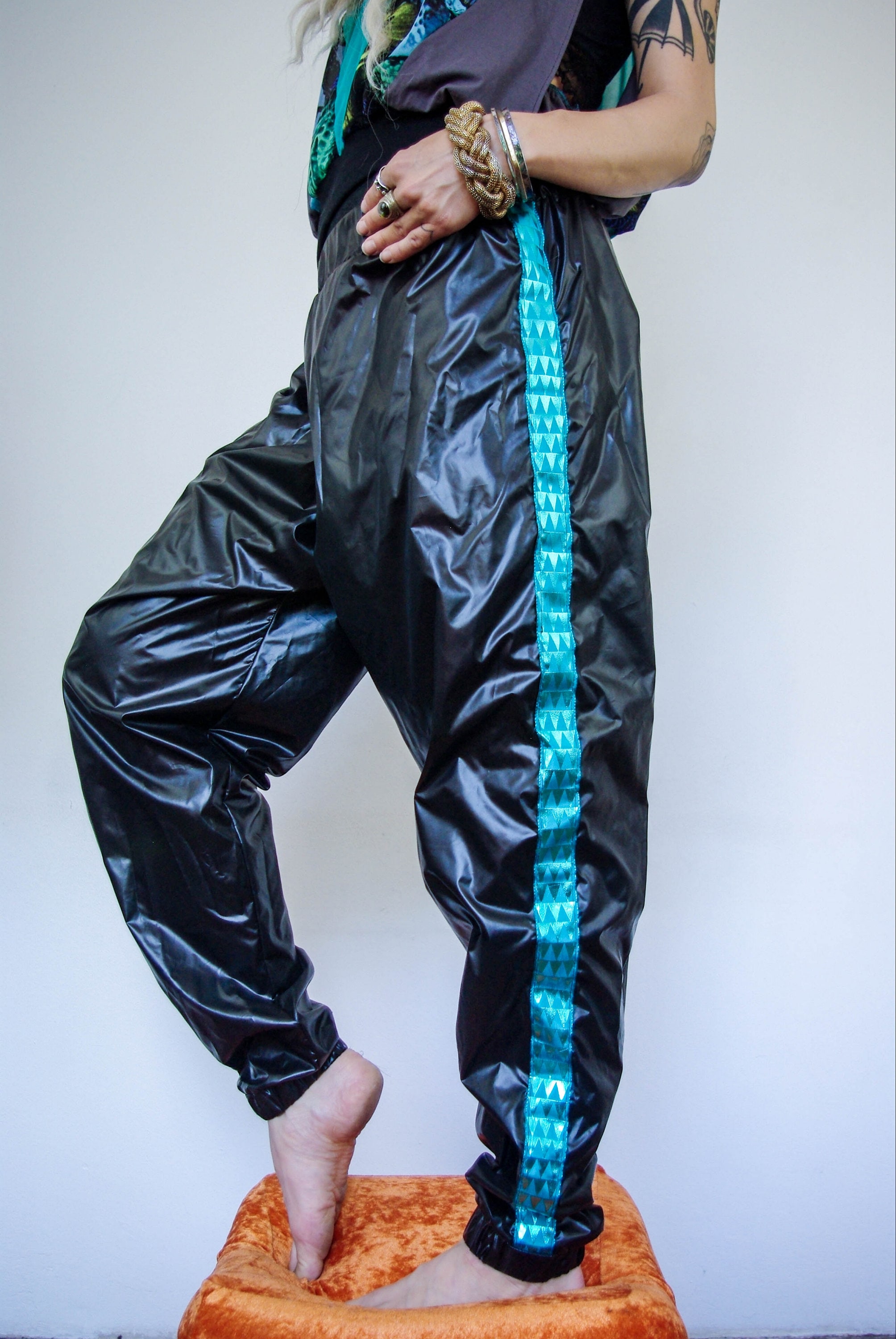 Shiny track pants 2025