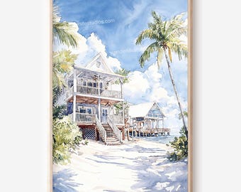 May include: Watercolor painting of a two-story white house with a balcony, stairs, and a palm tree. The house is on a sandy beach with a blue sky and fluffy clouds. A smaller building on stilts is visible in the background. The artwork is framed in a light wood.