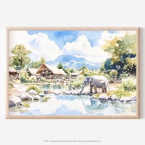 May include: Watercolor print of an elephant drinking from a pond in a lush, green landscape. The artwork features a light blue sky with fluffy white clouds, mountains, and buildings with thatched roofs. The print is framed in a light wood frame.