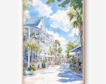 May include: Watercolor painting of a sunny street scene with buildings, palm trees, and people. The buildings have blue roofs and white balconies. The sky is blue with fluffy white clouds. The artwork is framed in a light wood frame.