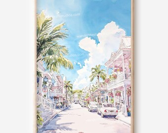 May include: Watercolor painting of a sunny street scene with palm trees, buildings, and cars. The artwork features a blue sky with fluffy white clouds and a light-colored wooden frame. The text "wanderlifestudios.com" is visible.