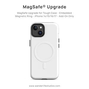 May include: White iPhone case with a MagSafe magnetic ring. The case has a black camera module and black accents on the sides. The text "MagSafe Upgrade" and product details are displayed at the top. The website address www.wanderlifestudios.com is at the bottom.