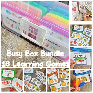 May include: A clear plastic storage case containing colorful dividers and educational activity cards labeled Busy Box Bundle 16 Learning Games. The set includes various printed cards for alphabet, color, and counting practice with illustrations.