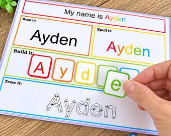 Pode incluir: Uma folha de exercícios educativa retangular intitulada My name is Ayden com seções para ler, soletrar, construir e traçar o nome Ayden. A seção de construção apresenta peças quadradas coloridas com letras.