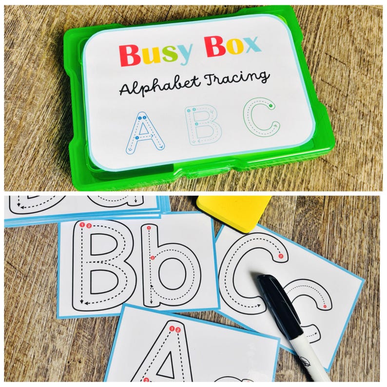 Puede incluir: Una caja de pl&aacute;stico verde con la etiqueta "Busy Box Alphabet Tracing" contiene tarjetas para trazar el alfabeto. Las tarjetas presentan l&iacute;neas punteadas para trazar las letras may&uacute;sculas y min&uacute;sculas A, B y C. Tambi&eacute;n se ve un rotulador negro.