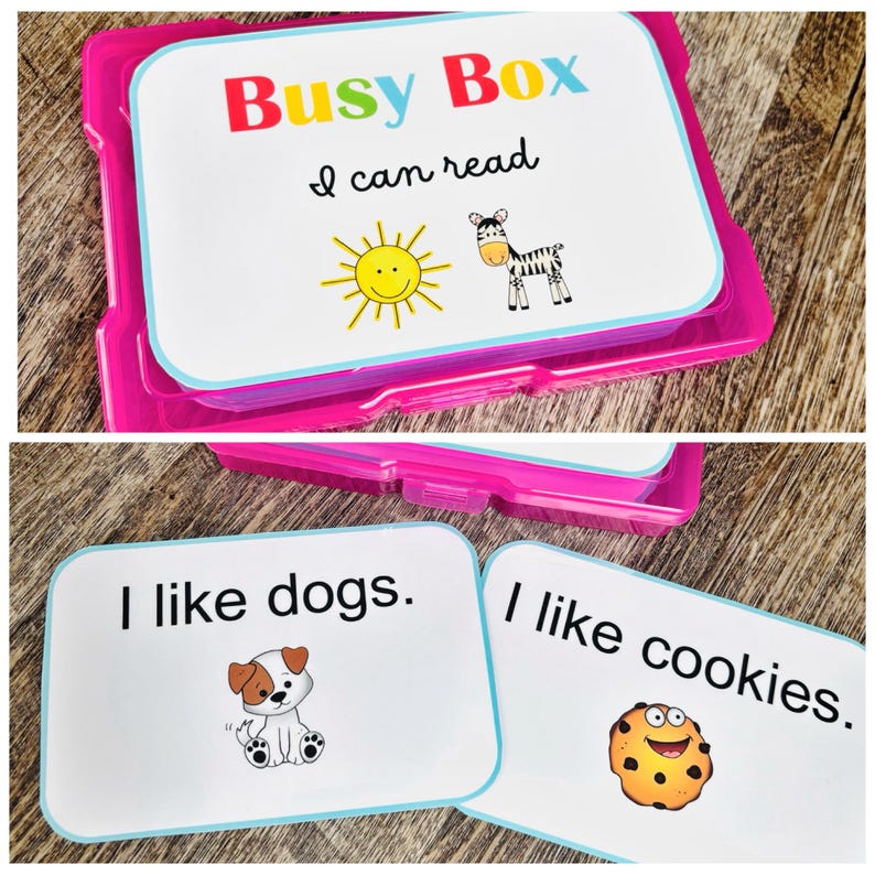 Puede incluir: Una caja de pl&aacute;stico rosa "Busy Box" con el texto "Busy Box" en rojo, amarillo y azul. La caja contiene tarjetas did&aacute;cticas con el texto "I can read", "I like dogs" y "I like cookies". Las tarjetas did&aacute;cticas tienen ilustraciones de un sol, cebra, perro y galleta.