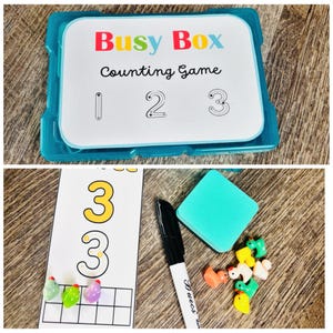 Puede incluir: Un juego de conteo Busy Box con una caja de pl&aacute;stico azul. El juego incluye tarjetas con los n&uacute;meros 1, 2 y 3, un rotulador de borrado en seco, una goma de borrar y contadores con forma de animales. Dise&ntilde;ado para el aprendizaje temprano.