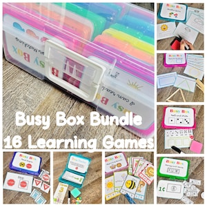 May include: A clear plastic storage case containing a Busy Box Bundle of 16 learning games. The set includes various colorful activity cards, small plastic containers, and educational materials featuring themes like weather, shapes, and counting.