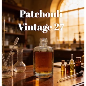 May include: A clear glass bottle filled with amber liquid, labeled "Patchouli Vintage 27," sits on a wooden surface. Several small glass vials and a pipette are arranged nearby. The background features laboratory glassware and a window.