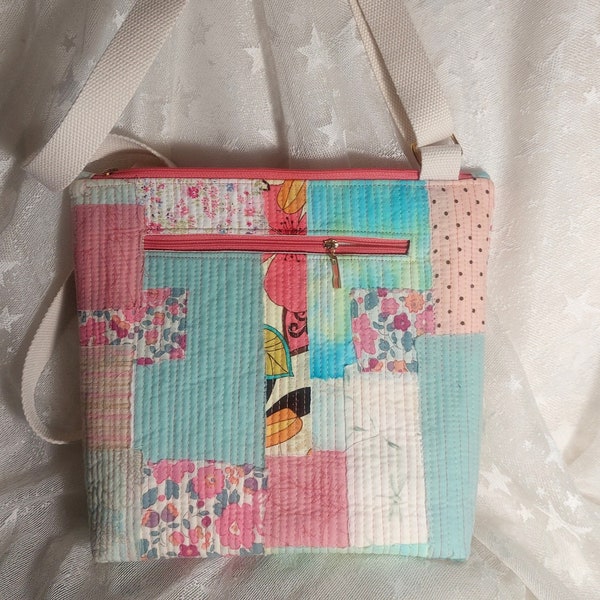Scrappy Kantha Style Quilted Crossbody Bag, handmade using cotton quilting scraps in turquoise and peachy-pinks.