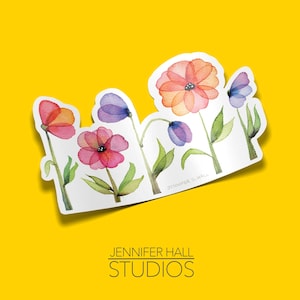 May include: A sticker featuring watercolor illustrations of pink, red, and purple flowers with green stems and leaves. The sticker is on a yellow background.