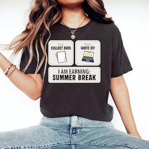 May include: A set of three ceramic mugs with a speckled, cream-coloured glaze. Each mug features a different hand-painted design: a blue and green leaf, a yellow flower, and a red berry. The mugs have a simple, rounded shape.