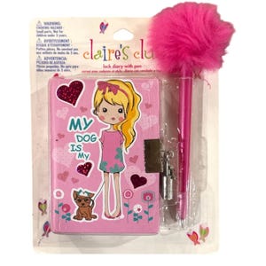 May include: Pink lock diary with pen. The diary features a cartoon girl with a dog, hearts, and the text "MY DOG IS My". Includes a pink pen with a fluffy pom-pom top. The diary has a silver lock.