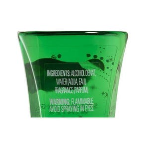 May include: Close-up of a green bottle with white text. The text includes ingredients: alcohol denat, water (aqua, eau), fragrance (parfum). It also includes a warning: flammable, avoid spraying in eyes.