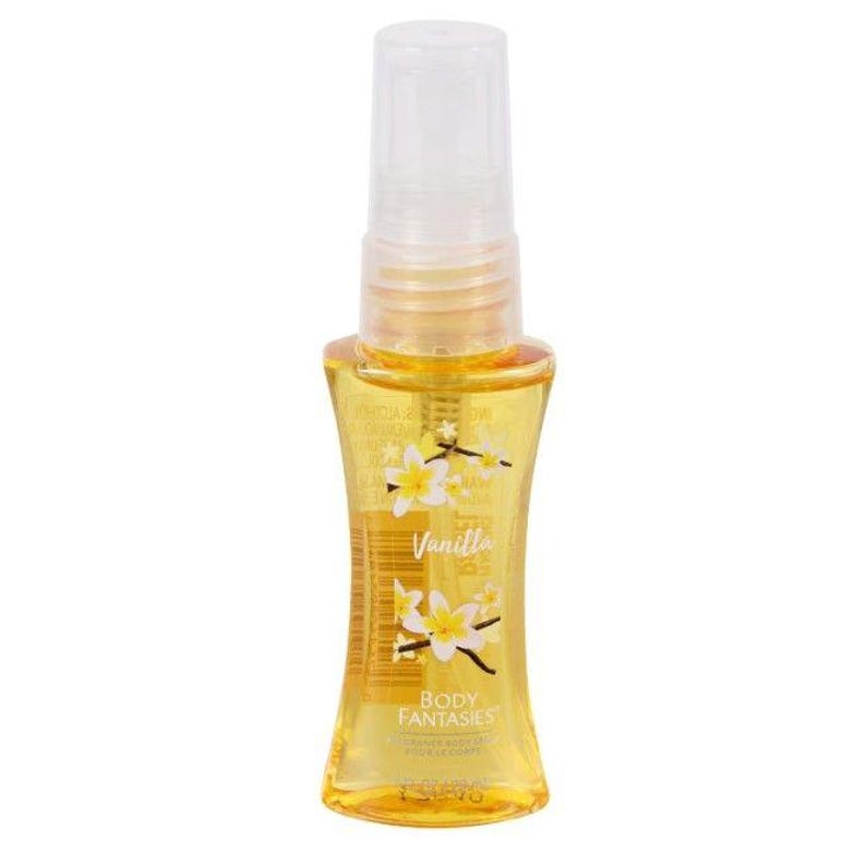 May include: A clear, yellow body spray bottle with a white cap. The bottle is labeled "Vanilla" with a floral design and "Body Fantasies" text. The spray bottle is filled with a yellow liquid.
