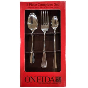 May include: A 3-piece completer set by Oneida in a red box, containing a teaspoon, salad fork, and iced tea spoon. The utensils are made of 18/0 stainless steel and are dishwasher safe. The packaging features the text 3 Piece Completer Set.