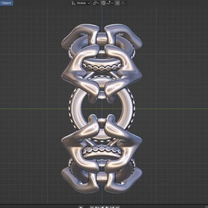May include: A silver metal sculpture with a complex, interlocking design. The sculpture is made up of multiple rings and loops that are connected in a way that creates a sense of movement and energy.