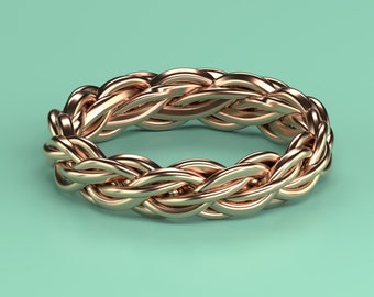 May include: A braided gold ring with a smooth, polished finish.