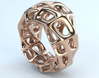May include: A rose gold ring featuring a complex, open-work lattice structure. The band is composed of interconnected, rounded geometric shapes that create a hollow, cage-like appearance with a polished, reflective metallic finish throughout.
