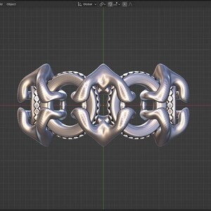 May include: A silver metal ring with a complex, interlocking design. The ring is made up of multiple pieces that are connected in a way that creates a three-dimensional effect.