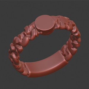 May include: A brown ring with a textured, organic design. The ring has a smooth, round top.