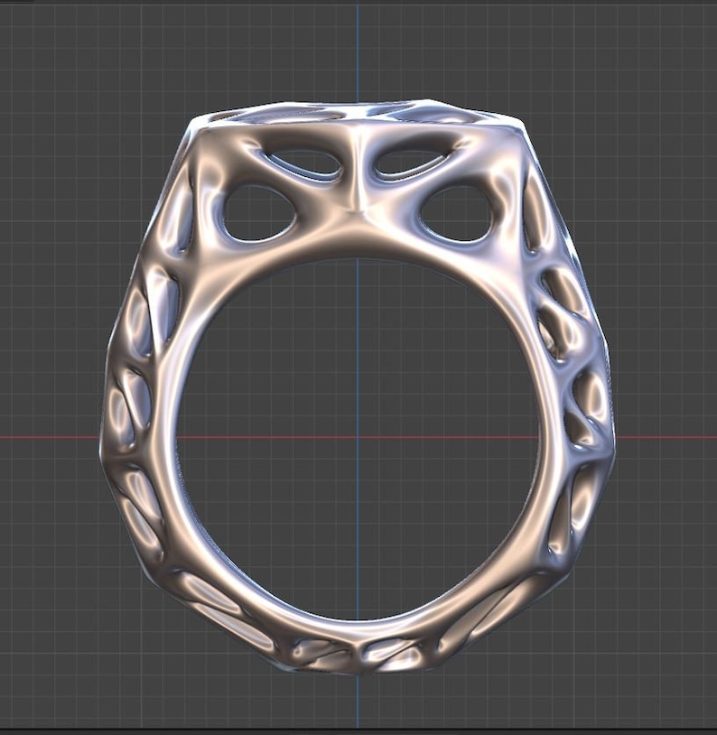 May include: A silver ring with a geometric design. The ring has a textured surface and a hollow center.