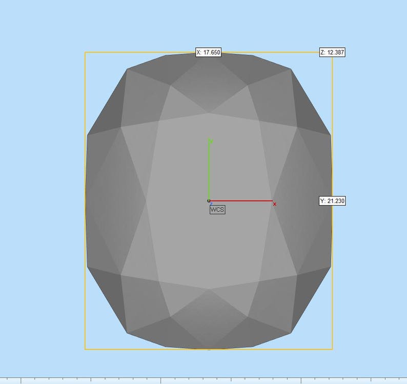 Puede incluir: Un objeto geom&eacute;trico gris de facetas tridimensionales mostrado en una interfaz de modelado digital. El objeto presenta un sistema de coordenadas central etiquetado como WCS con ejes rojo, verde y azul. Las etiquetas num&eacute;ricas X: 17.650, Y: 21.230 y Z: 12.387 son visibles.