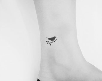 small cardinal and butterfly tattooTikTok Search
