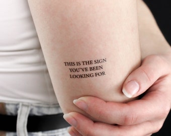 May include: A temporary tattoo with the text "This is the sign you've been looking for".