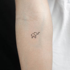 Tatuaggio temporaneo elefante con proboscide rivolta verso l'alto (set di 3)