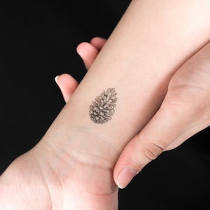 Tatuaggio temporaneo cono di conifera (set di 3)