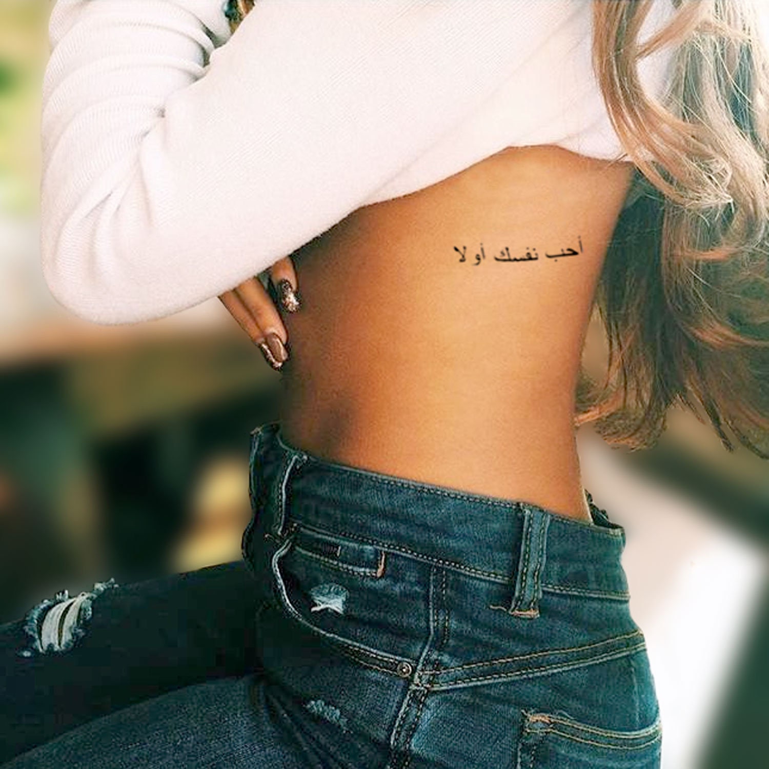 Exclusive Find Out the Meaning Behind Selenas New Tattoo  E Online