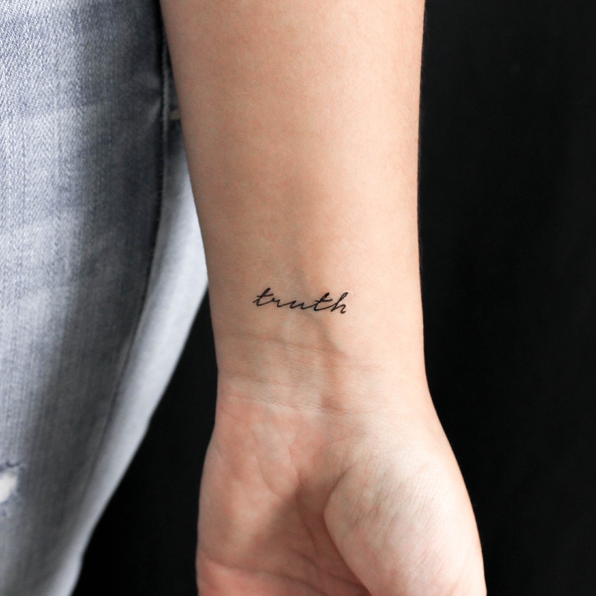 Lettering tattoo that says 