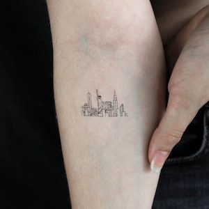 Piccolo tatuaggio temporaneo sullo skyline di New York (set di 3)