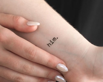 May include: A temporary tattoo with the word "him." applied to a person's wrist.