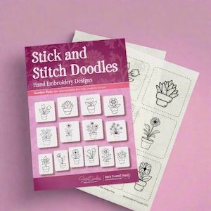 May include: A book titled "Stick and Stitch Doodles" featuring hand embroidery designs for garden pots. The book has a pink background with a floral pattern and black and white illustrations of various potted plants. The book is open to a page showing 12 different designs for garden pots, each approximately 4 cm high.