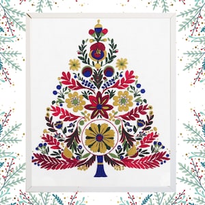 May include: A framed embroidery of a Christmas tree design. The tree is made up of colourful floral patterns in red, yellow, blue, and green on a white background. The frame is white, and the image has a decorative border.