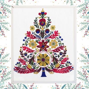 May include: A framed embroidery of a Christmas tree, featuring a folk art design. The tree is made up of red, yellow, blue, and green floral patterns on a white background. The frame is white, and the style is reminiscent of traditional crafts.