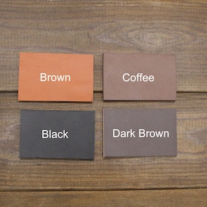 May include: Four leather swatches in different shades of brown. The swatches are labeled "Brown", "Coffee", "Black", and "Dark Brown".