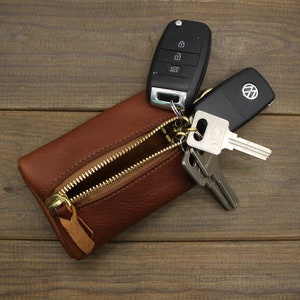 Sold at Auction: Louis Brown, Louis Vuitton Mini Lockit Nomade Bag Leather  brown Keychain Accessory Key Holder
