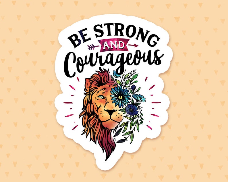 May include: A white sticker featuring a lion's head with colourful flowers and leaves covering its face. The text "Be Strong and Courageous" is above the lion's head.
