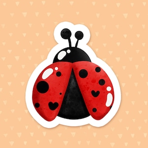 May include: A red and black ladybug sticker with white spots and a heart shape on each wing. The ladybug is on a peach background with a pattern of small white triangles.