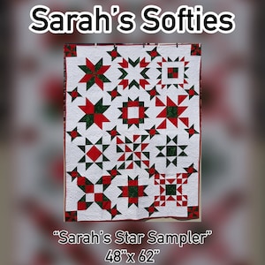 May include: A red and green quilt with a star pattern. The quilt is labeled "Sarah's Star Sampler" and measures 48" x 62".