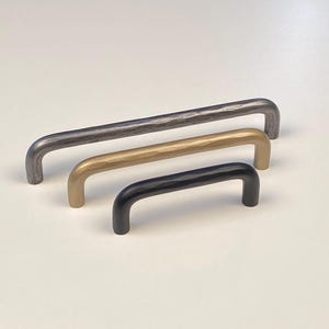 Hand forged hammered cabinet pulls. 1/2” and 3/8” round stock. (Cody)