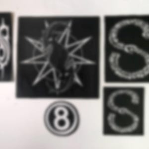 May include: A collection of black and white patches featuring various designs. Included are the letter "S" in a stylized font, a circular patch with the number "8", and a square patch with a star and a symbol.