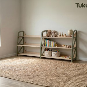 Montessori toy storage shelf in Military Green used in a kids play corner, organized with books and toys, wooden nursery furniture by TukuTuk.
