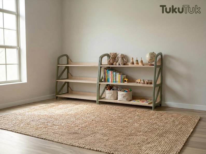 Montessori toy storage shelf in Military Green used in a kids play corner, organized with books and toys, wooden nursery furniture by TukuTuk.