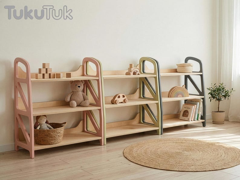 Montessori shelf trio in Dusty Blush, Sage Teal and Slate Gray used as toy storage in a kids play corner, showing wooden toys and books organized on wooden shelves.