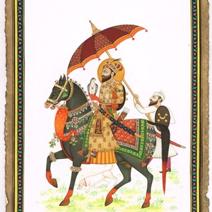 Indian Miniature Painting Of Sikh Guru Gobind Singh On Horse With Bird 9.5x14 Inches | Painting Decorated With Real Stone Ruby & Emerald